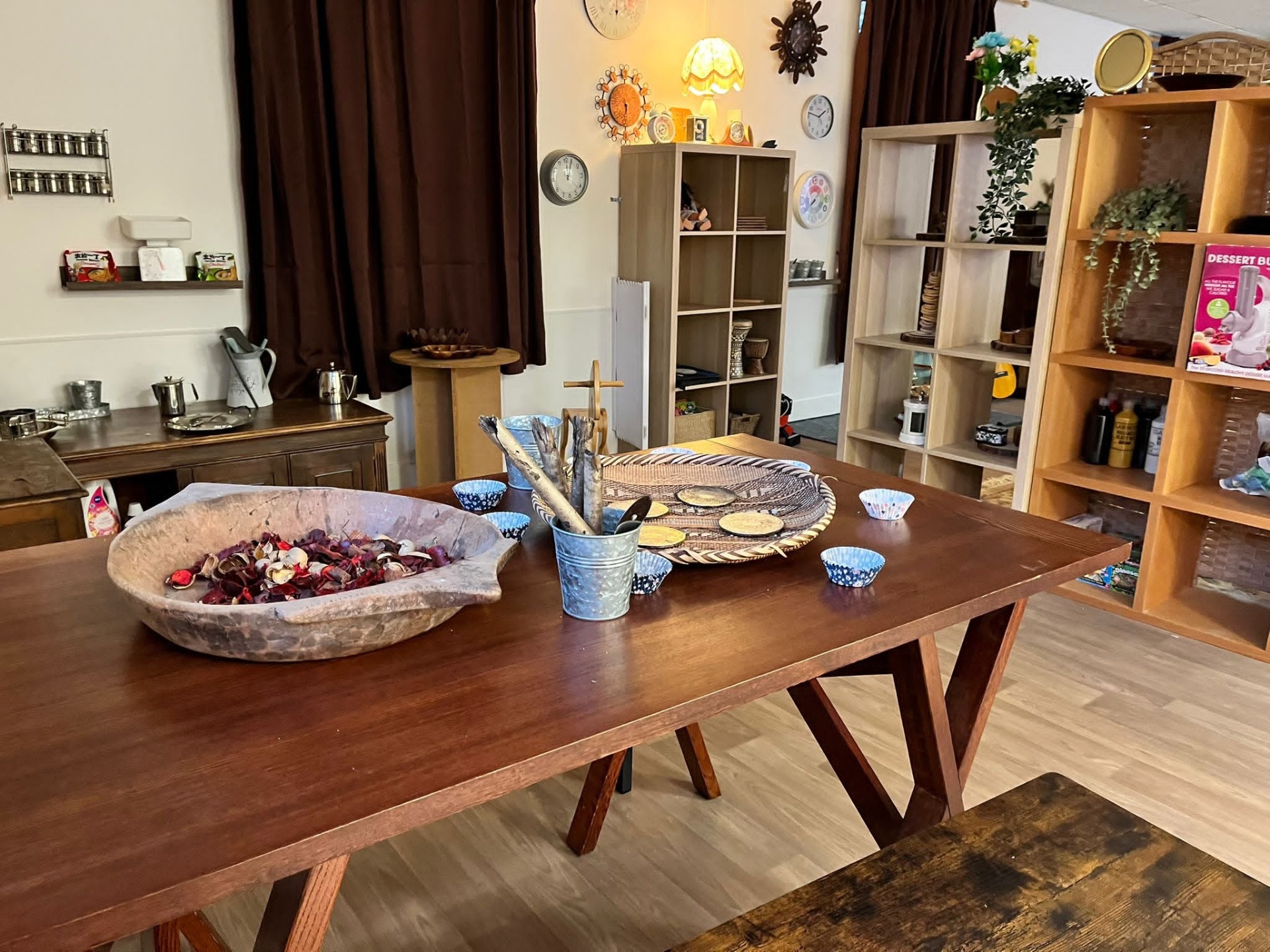 Calm Curiosity Approach playroom with natural wood, plants and open ended resources at our Cardiff nursery