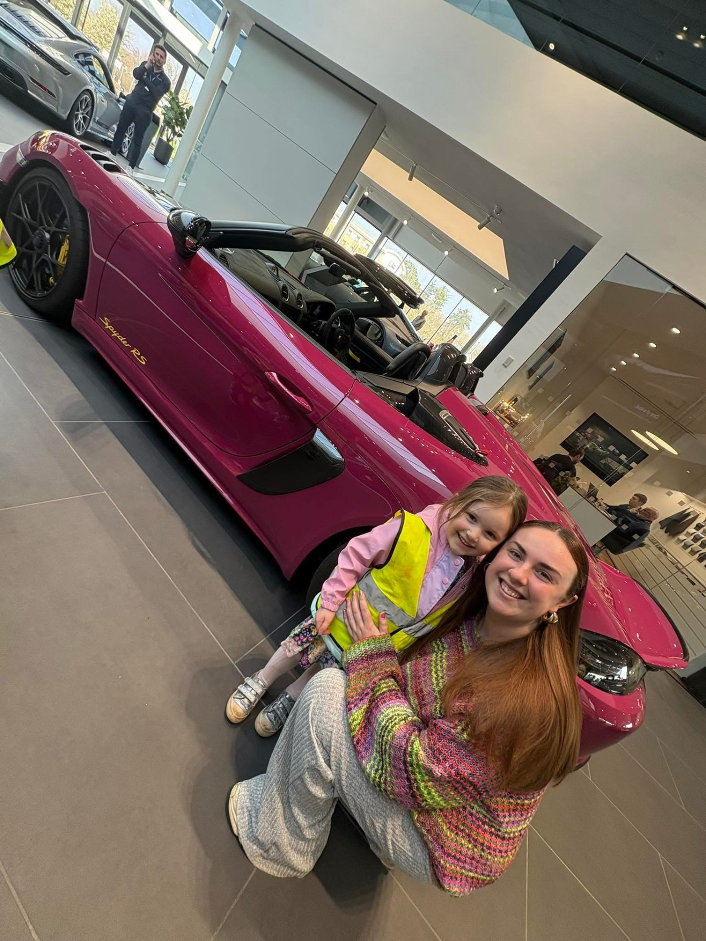 Children visiting a Porsche racing car at a local business linked to the Newport nursery community